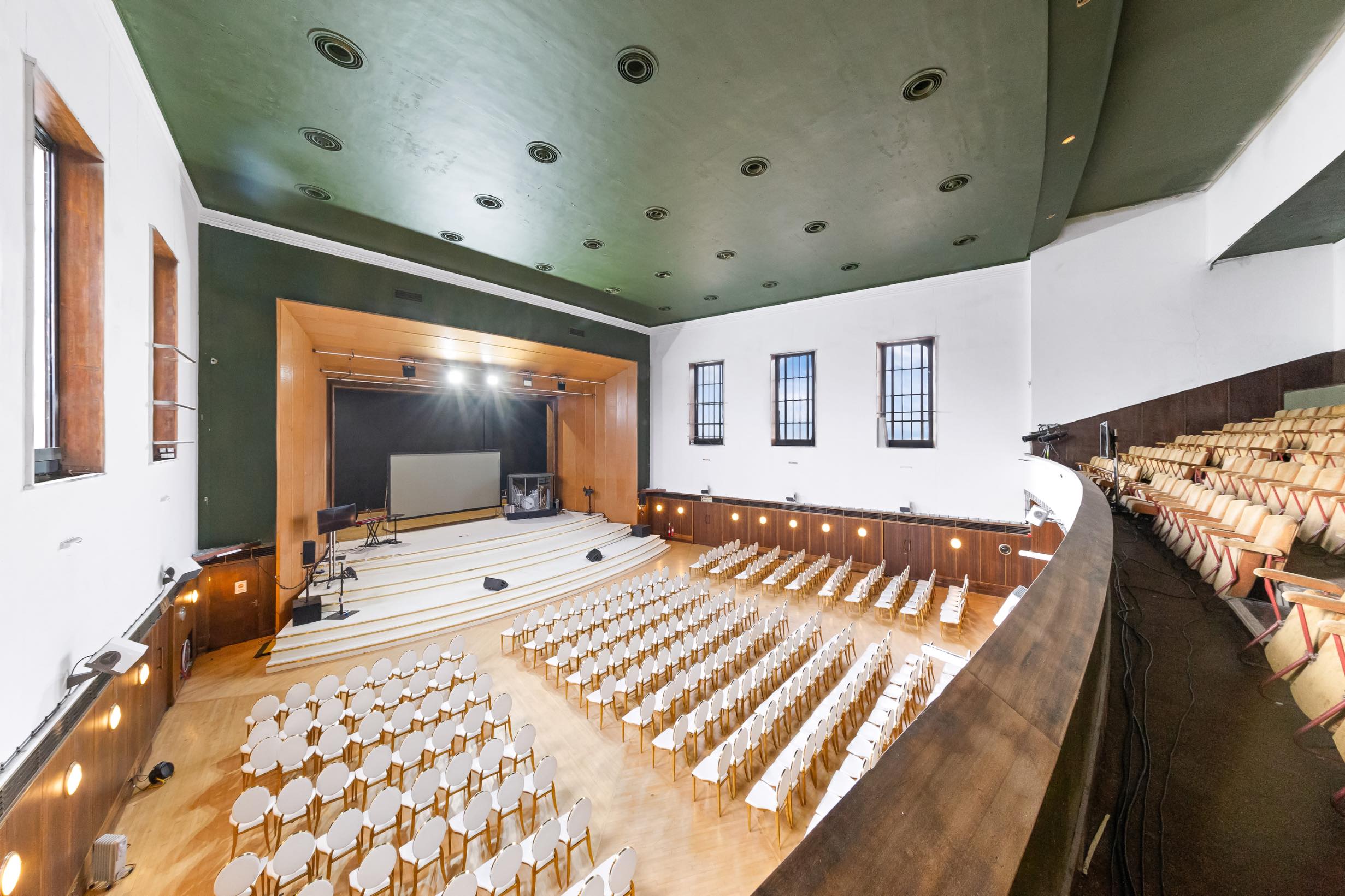 Well-lit auditorium with stage, standard lights, and flexible layout and Kitchen for hire in Greenwich