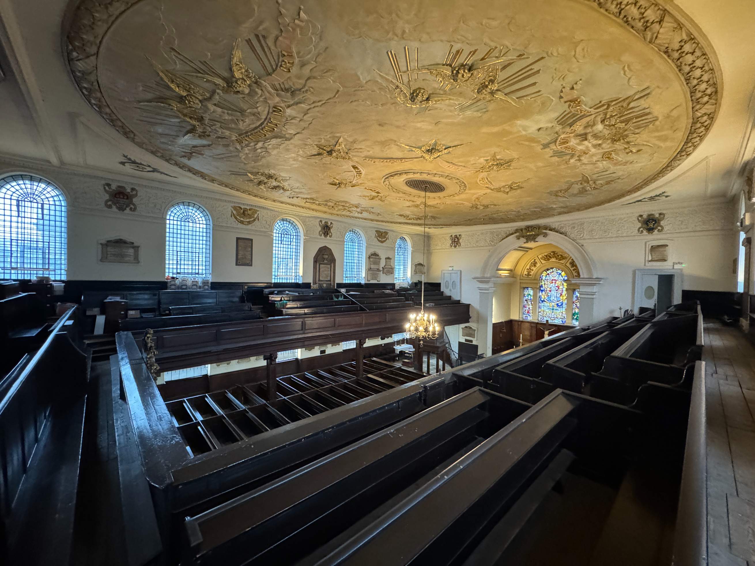 Ceiling view of the church reveals traditional arches and lighting ideal for performances, launches, or talks