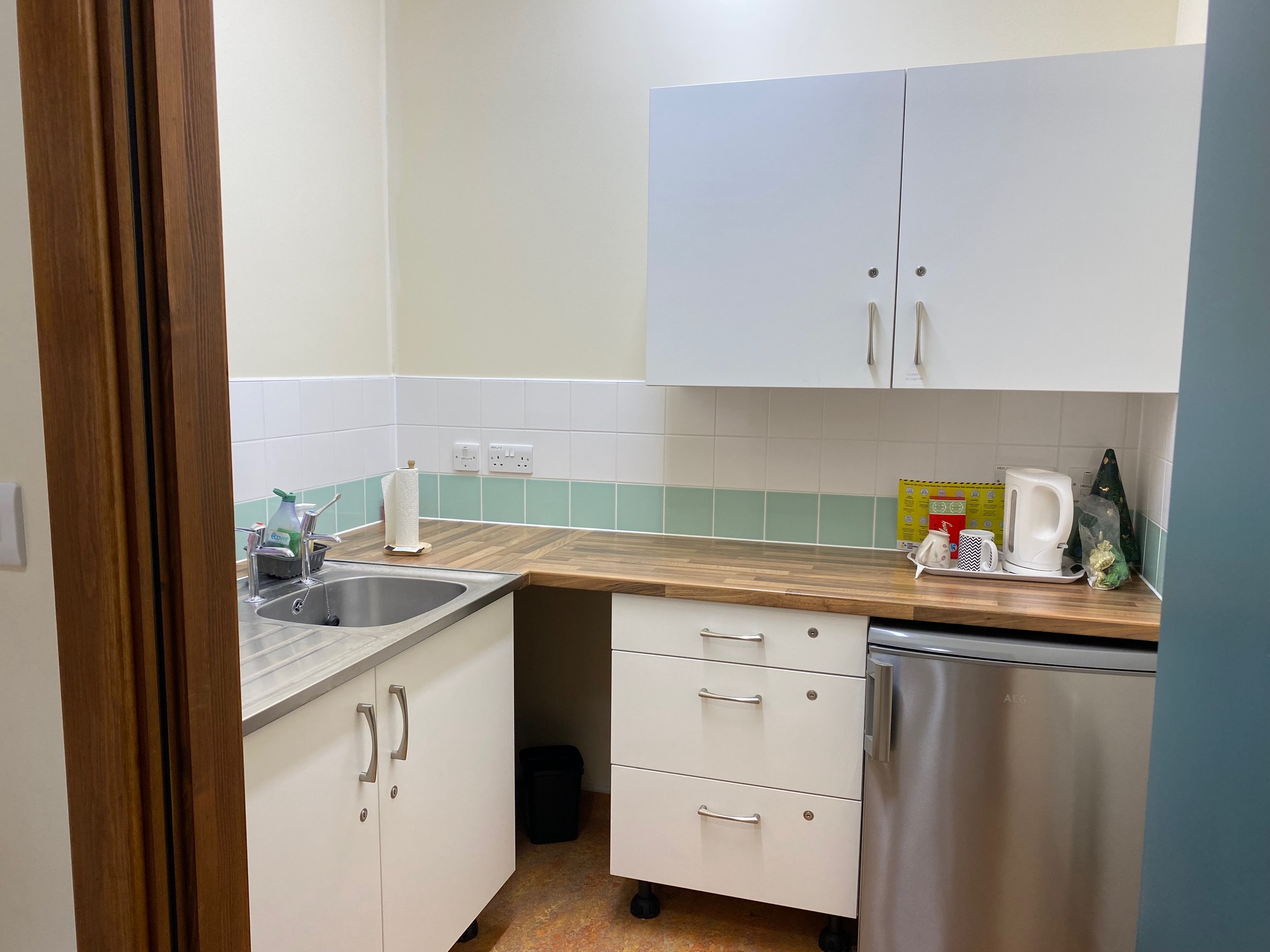Compact kitchen area supporting refreshments and light catering for studio events and community hires