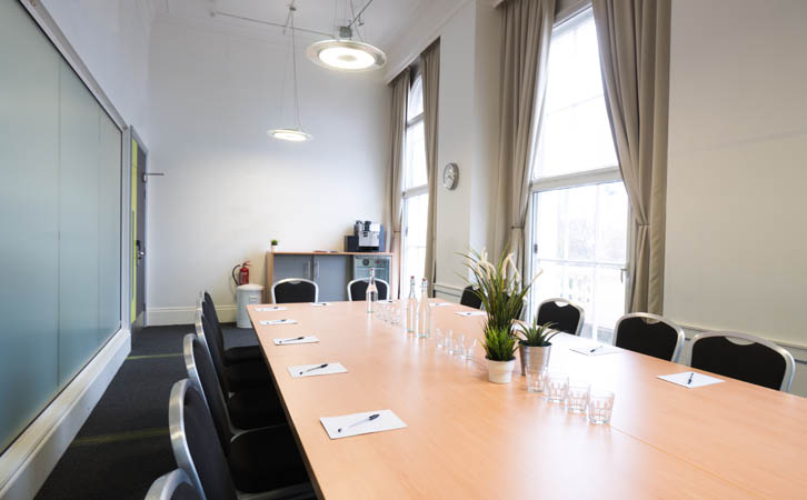 Premium Fitzrovia corporate workshop venue with large windows, bright natural daylight, and garden views.