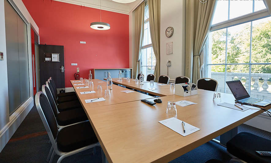 Impressive Central London corporate space with a large conference table setup, premium high ceilings, and modern styling