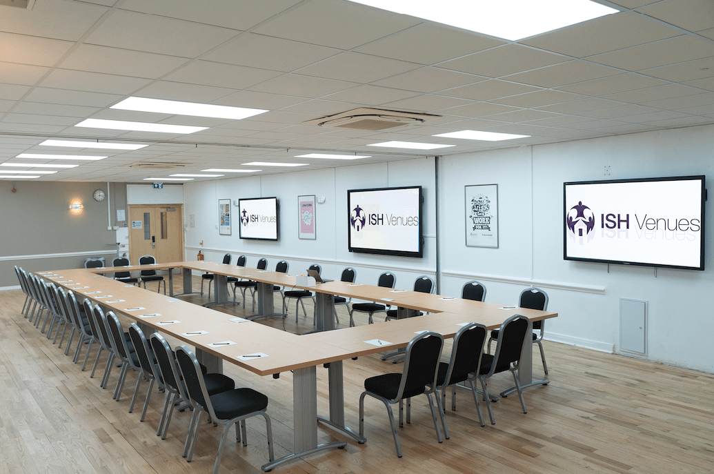 Impressive London corporate conference space with a professional U-shape layout, perfect for high-impact training workshops.