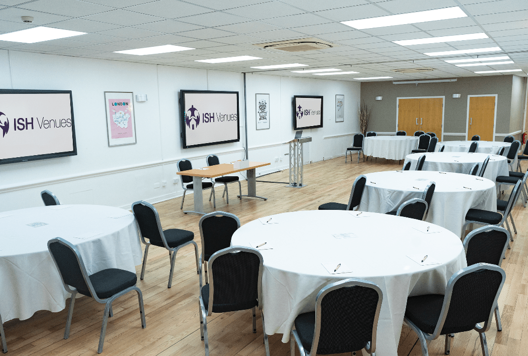 Elegant London wedding reception setting featuring pristine round tables, beautifully styled for up to 150 guests.