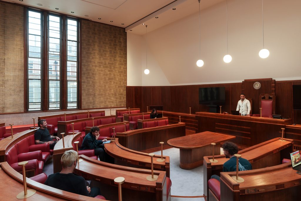 Historic Council Chamber at Hornsey Town Hall featuring original circular layout and rich wood panelling, an iconic London venue hire