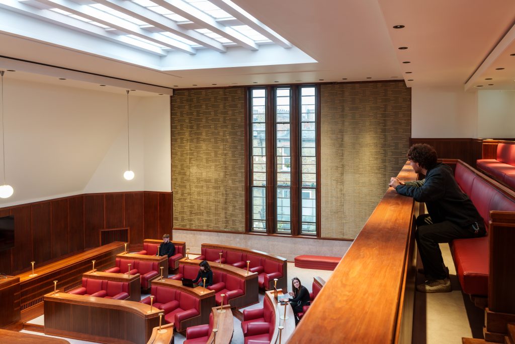 Art Deco Council Chamber at Hornsey Town Hall bathed in natural light through soaring windows, perfect for weddings and press launches