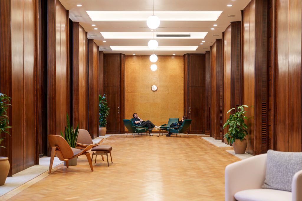 Sunlit Committee Room at Hornsey Town Hall with warm wood panelling and lounge seating, a sophisticated heritage venue in North London