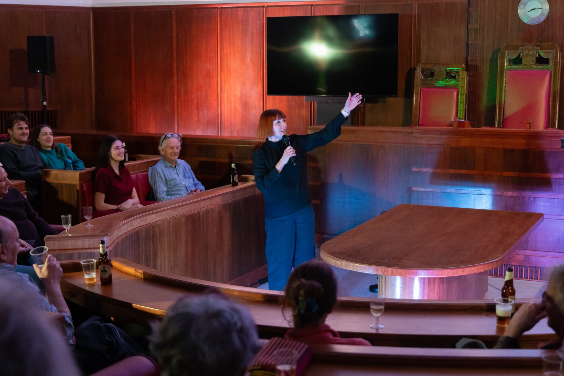 Professional speaker presenting in the iconic circular Council Chamber at Hornsey Town Hall, ideal for high-profile launches and conferences