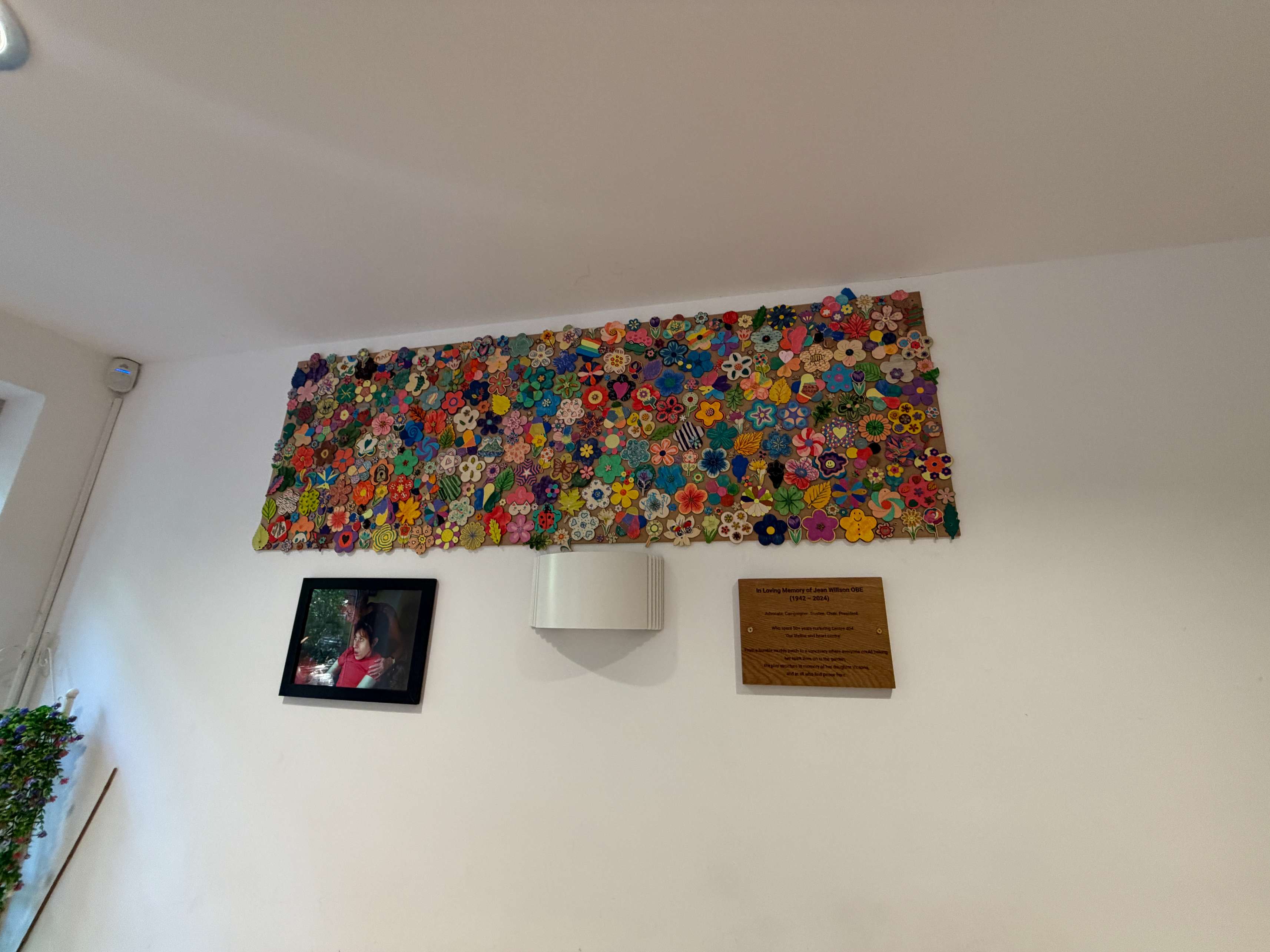 Colourful mosaic artwork displayed on the wall of the Garden Room at Centre 404