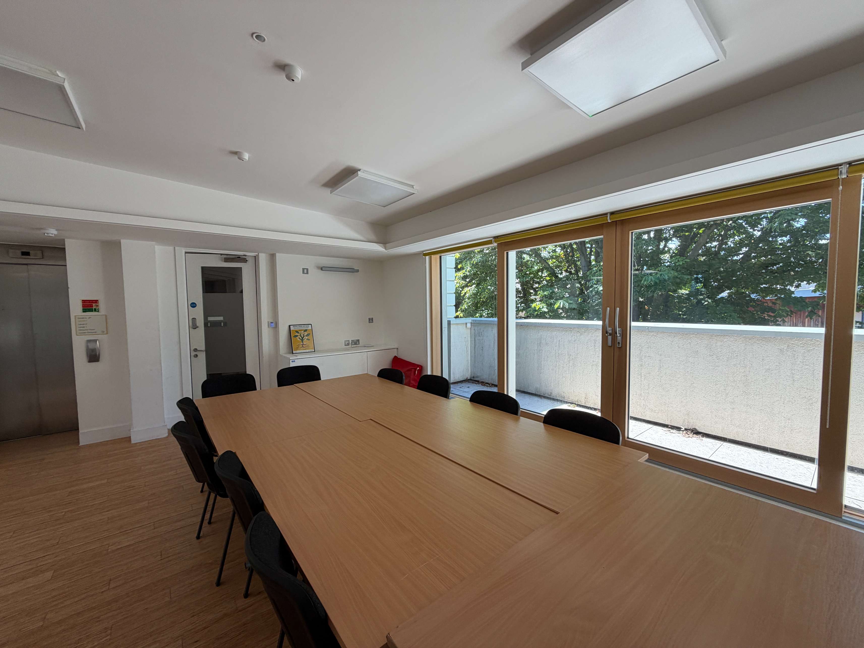 Training Room at Centre 404 with long boardroom-style table and large windows, London N7