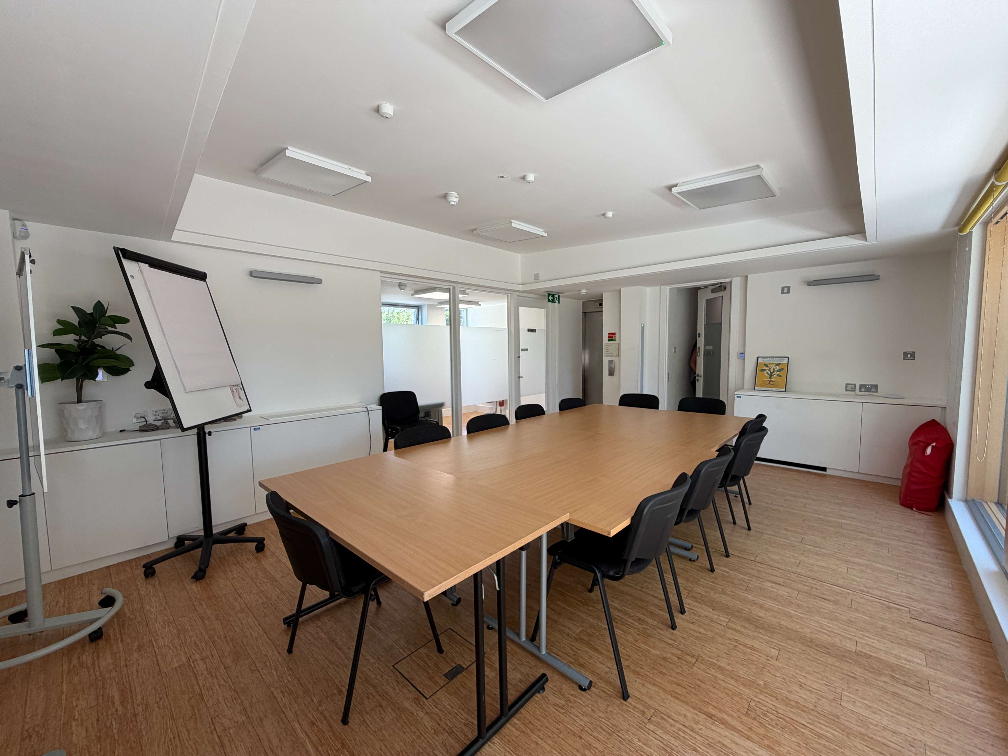 Training Room at Centre 404 with flipchart, wooden table and chairs, natural daylight