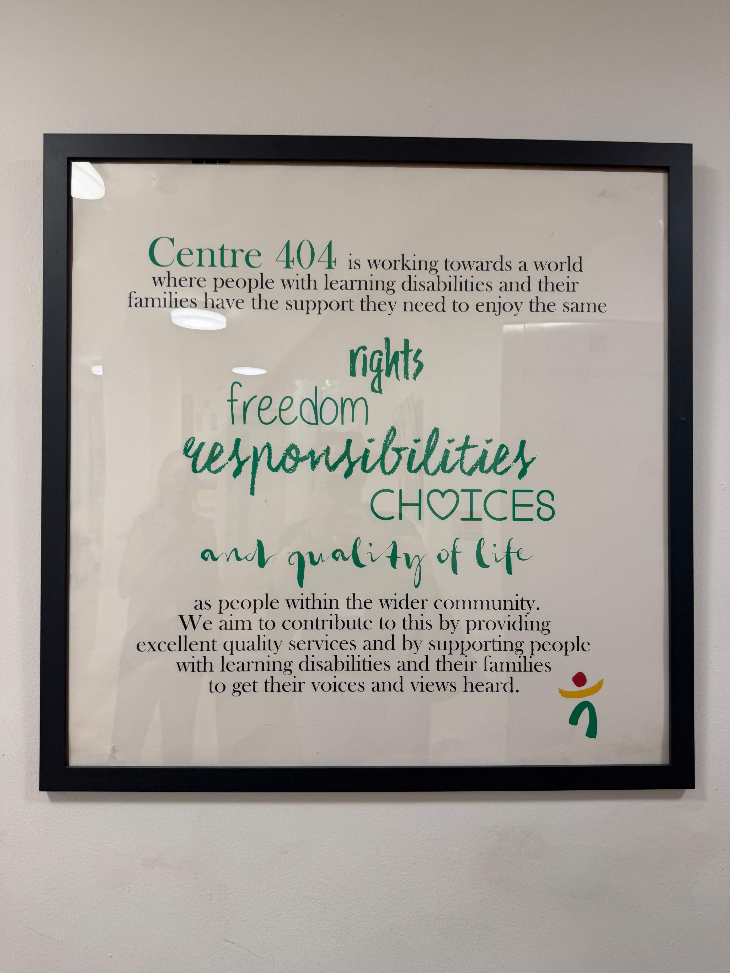 Framed artwork at Centre 404 reading "rights, freedom, responsibilities, choices" reflecting the charity's values