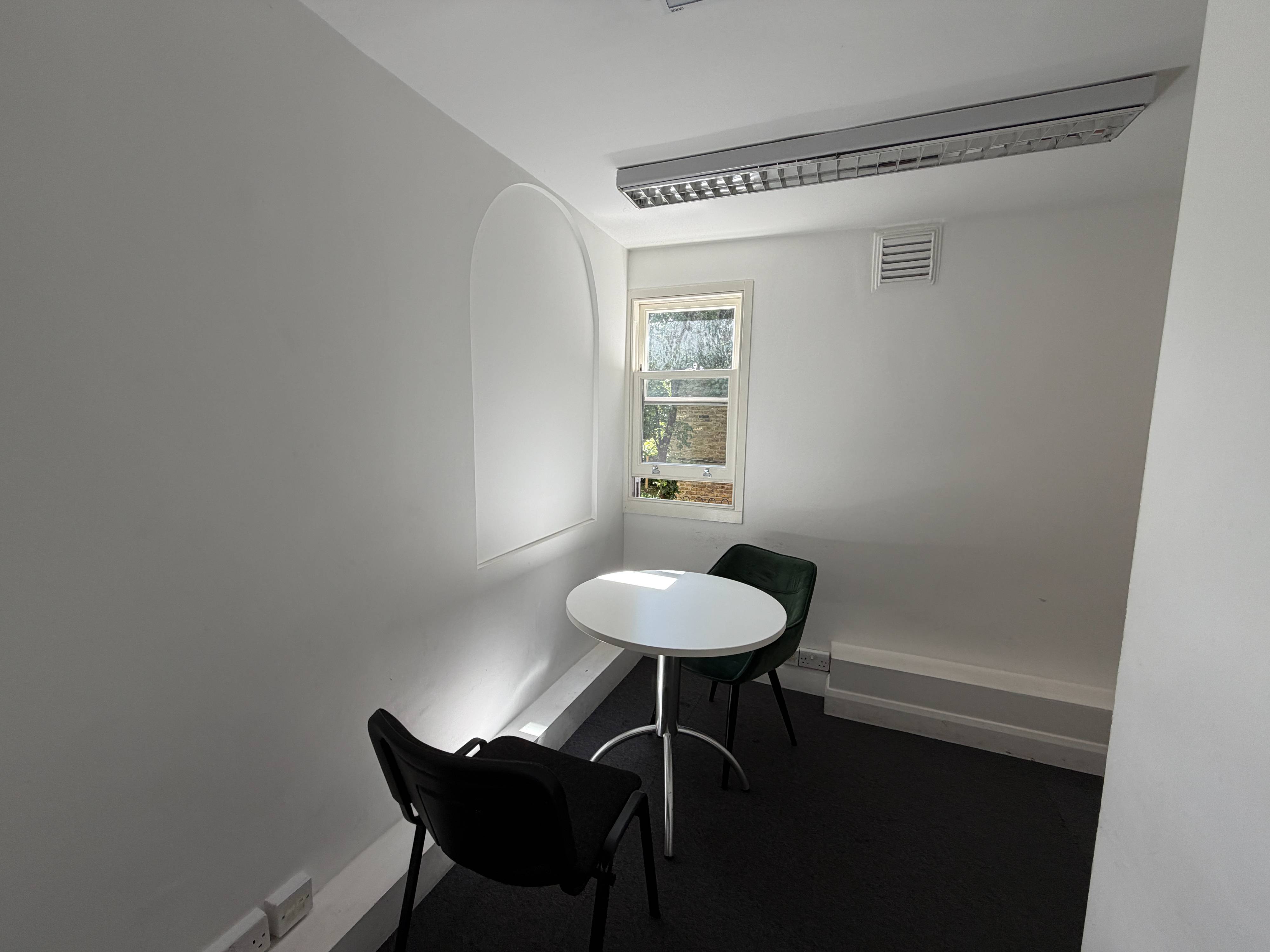 Therapy Room at Centre 404 with window, round table and chairs, quiet natural light