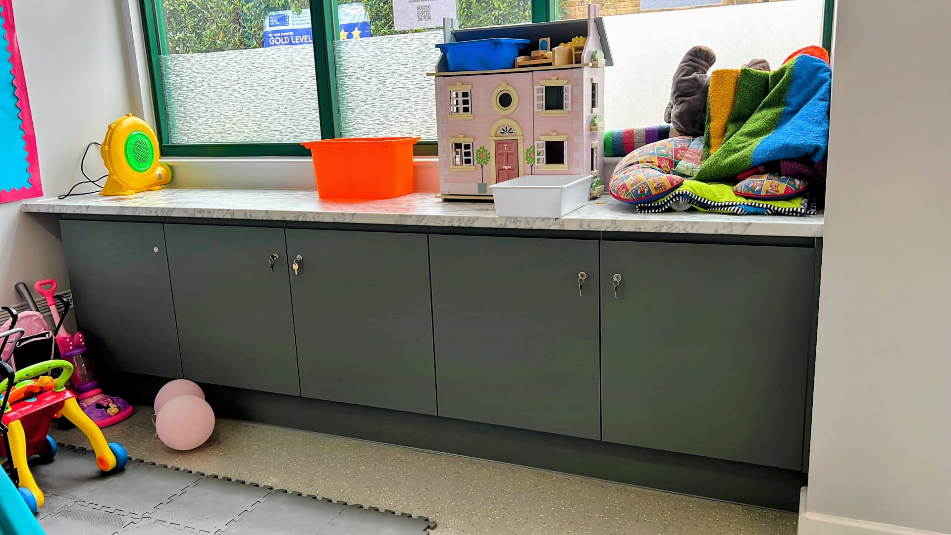 Kitchenette area within the Allie Harper Room at Ivy Street Family Centre, equipped with counters and storage for catering at events.