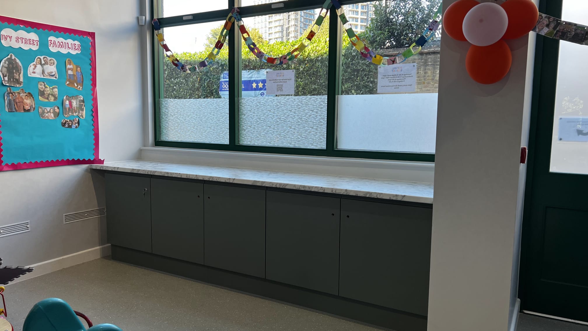 Bright windowed room interior at the Allie Harper Room, Ivy Street Family Centre, suitable for classes, workshops, and community gatherings.