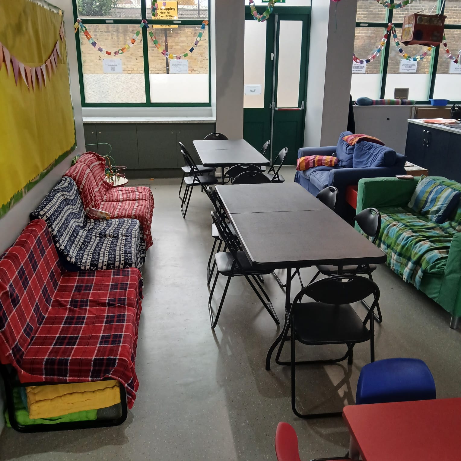 Comfortable lounge seating area inside the Allie Harper Room at Ivy Street Family Centre, Islington, suited for relaxed gatherings and community event