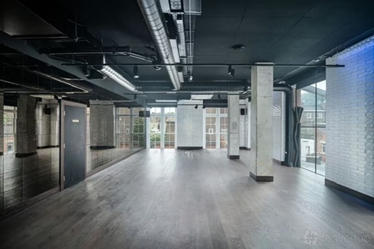 The spacious Om Nom Studio in Islington shown empty with an open floor plan and modern interior, ideal for yoga classes, events, and private hire.