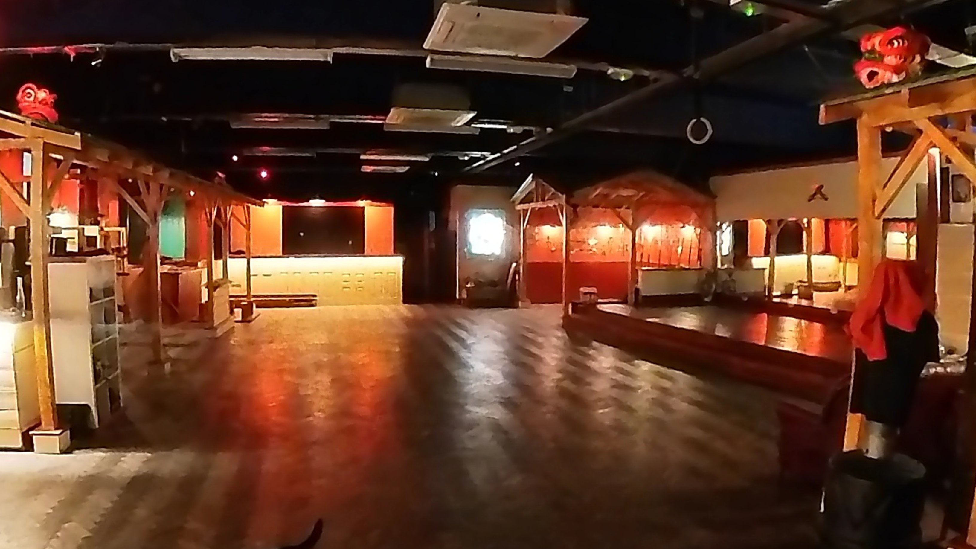Zhulin Hidden Village event space in Lewisham with warm mood lighting and a spacious wooden floor, suited to dance classes, yoga, corporate events, an