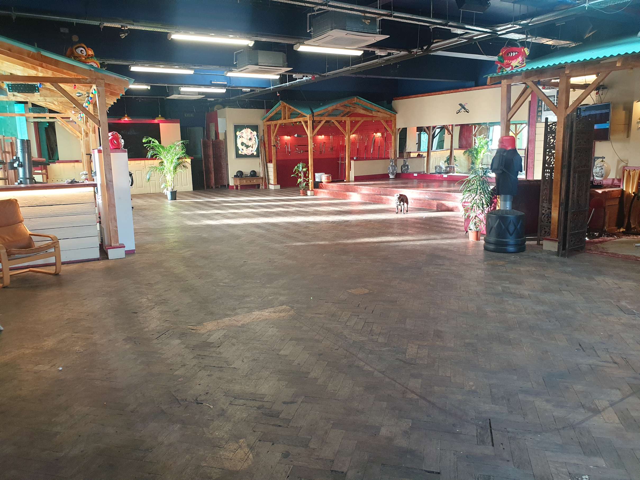 Full length view of the main event space at Zhulin Hidden Village in Lewisham, highlighting the spacious layout and ambient lighting suited to large e