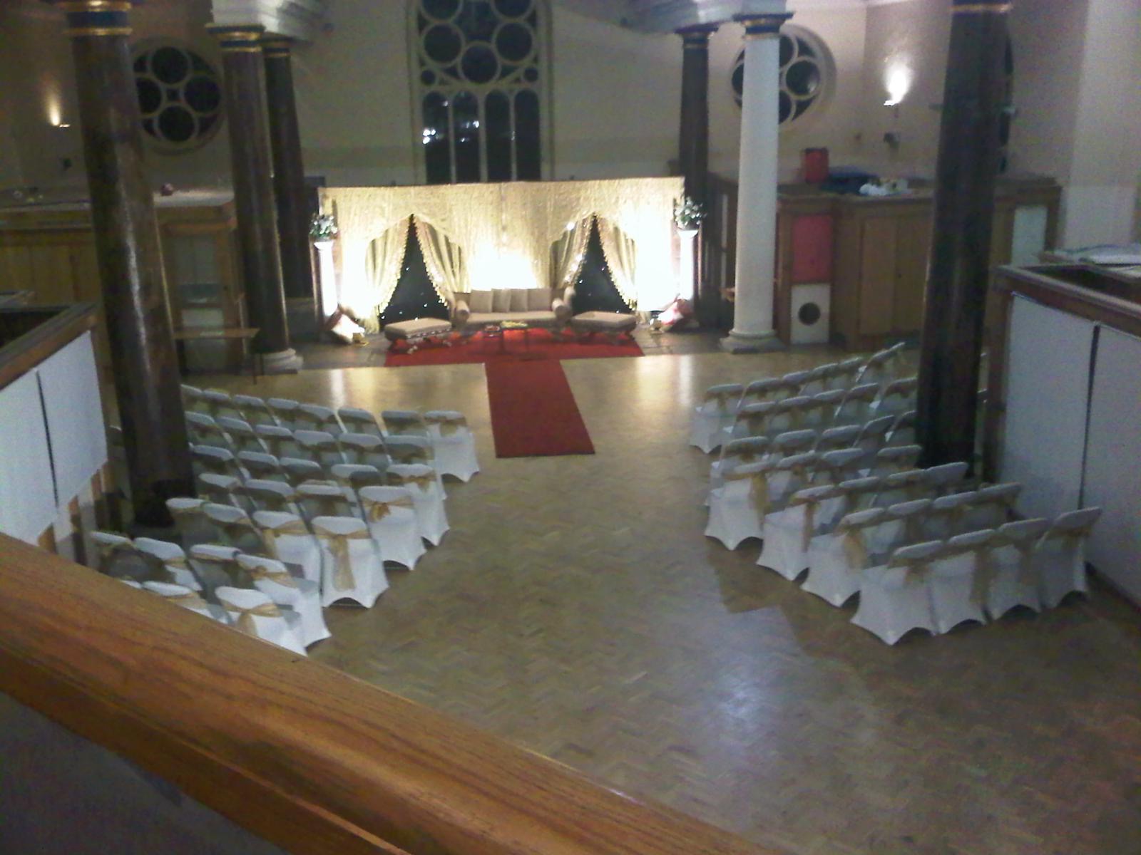 St Matthias Church Hall arranged with long white clothed tables in a banquet style layout, offering an elegant setting for wedding receptions, corpora