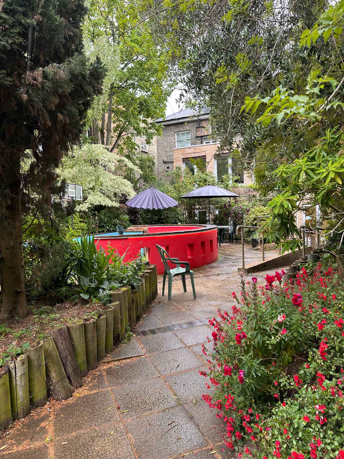 Garden Room with red bench and flower garden at Centre 404, outdoor event space hire London