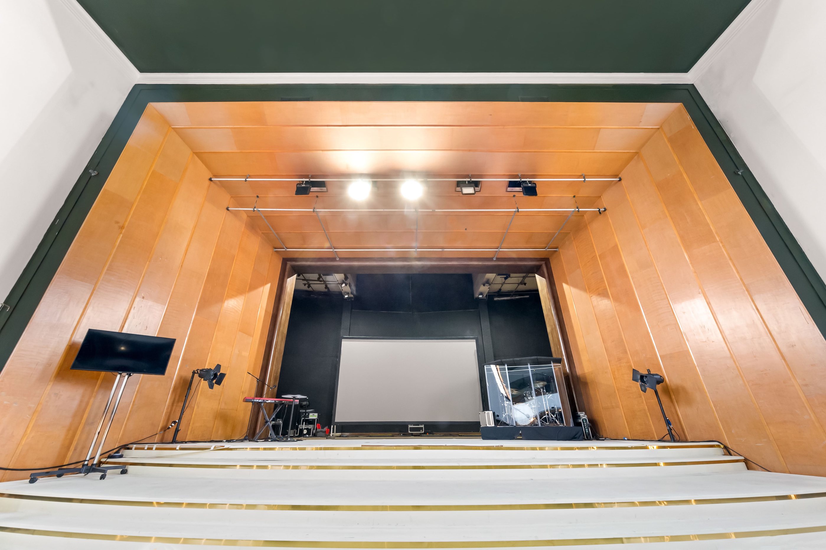 High-capacity(Upto 800 people, 400 seating)auditorium with soundproofing, lighting options, and projector screen