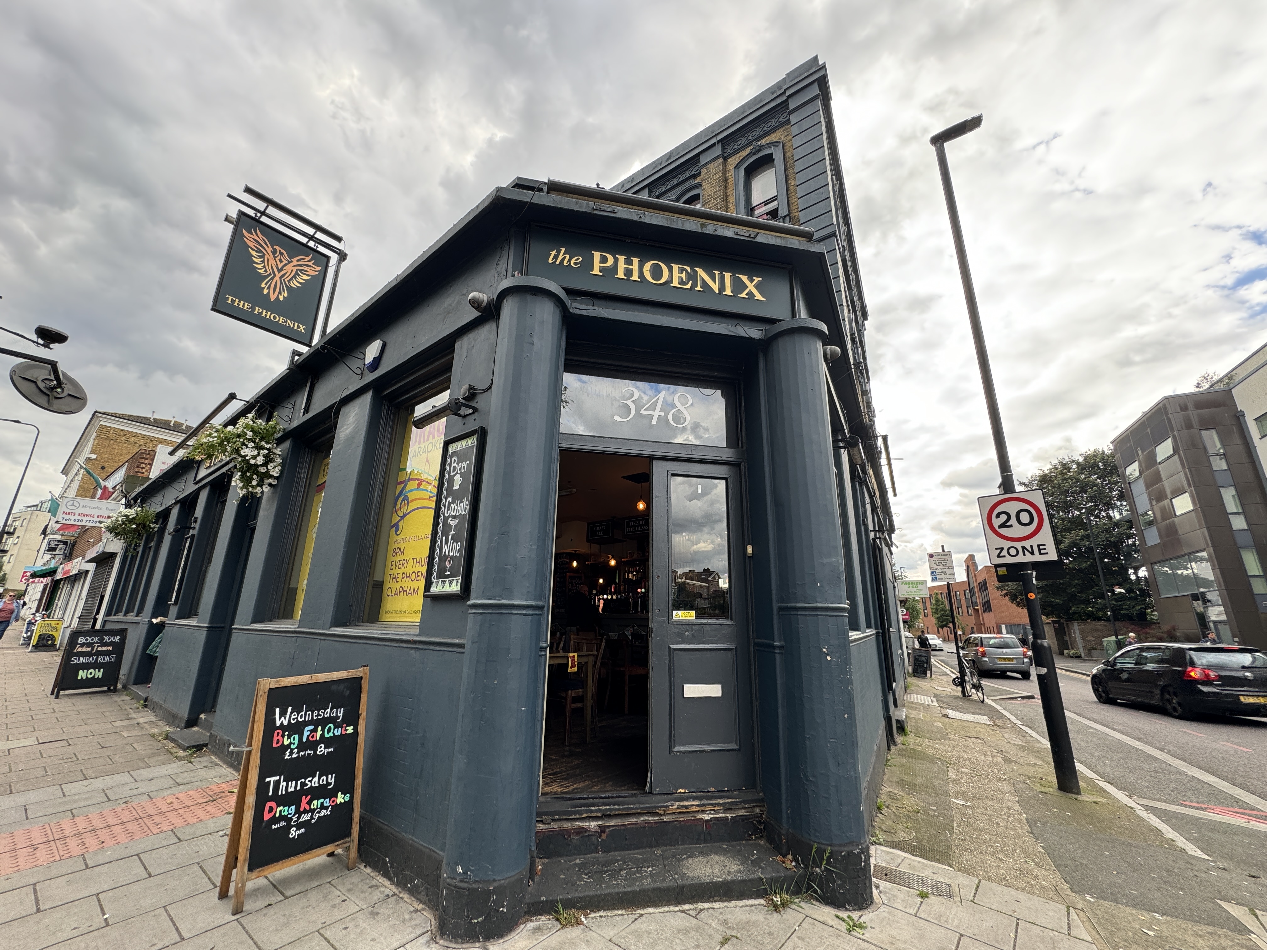 Exterior façade of The Phoenix pub at 348 Clapham Road, with signage and entrance visible from street view
