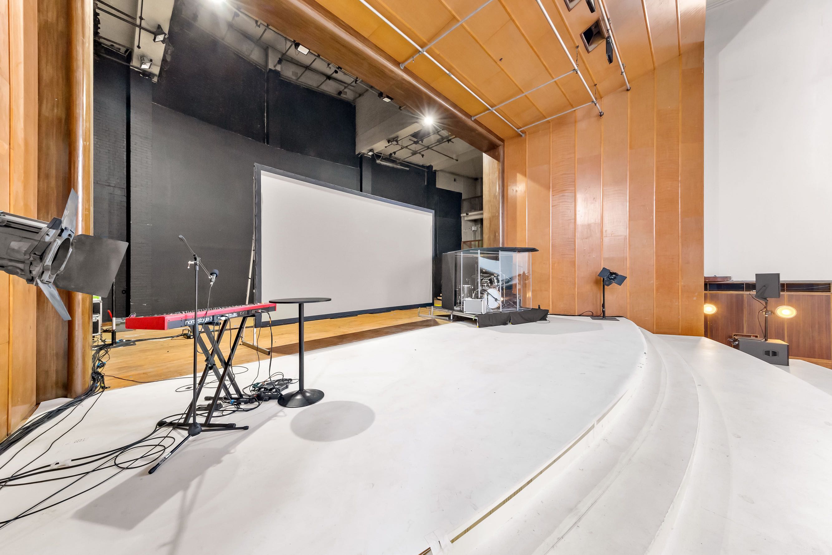 Stage view from the back of the hall showing 400-seat layout — available to book via Conveenie