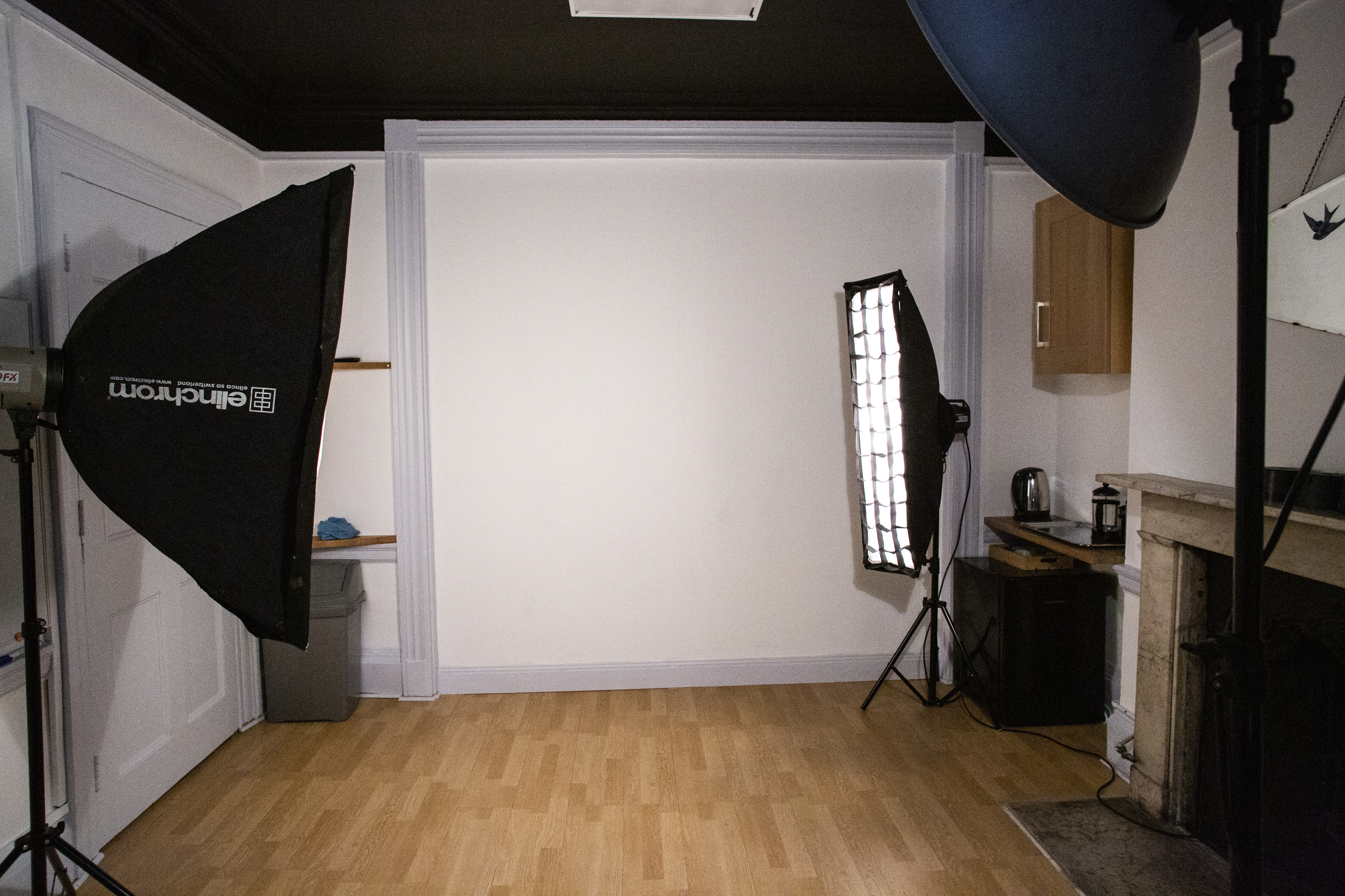 The Study, a professional London photography studio for 10, featuring two large softbox lights and a simple white backdrop.