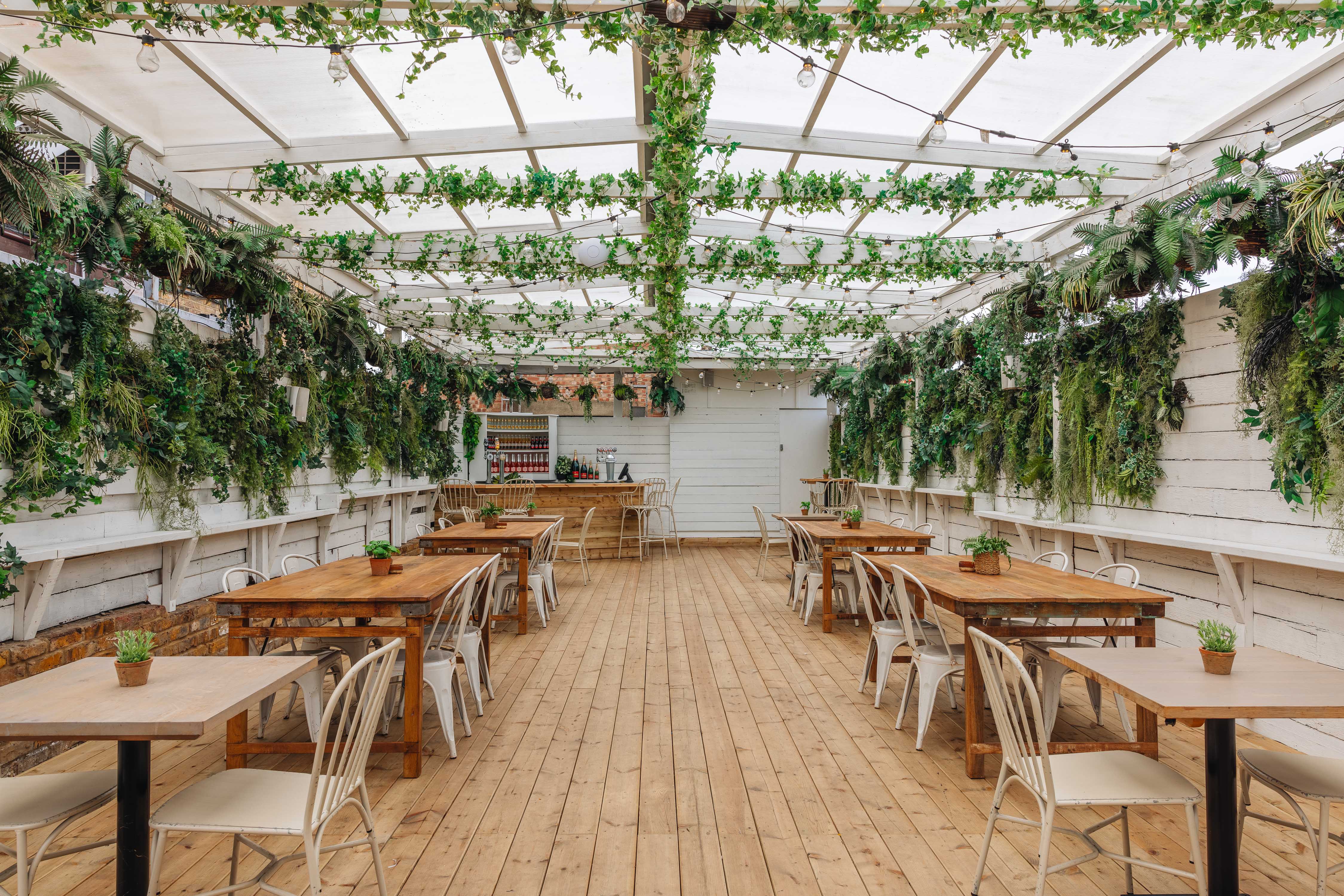 Exhibit Balham Garden romantic London wedding venue with leafy indoor–outdoor space and soft ambient lighting.
