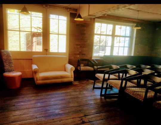 Bright, airy venue above a cafe in Kennington with flexible seating and rustic charm, ideal for private events