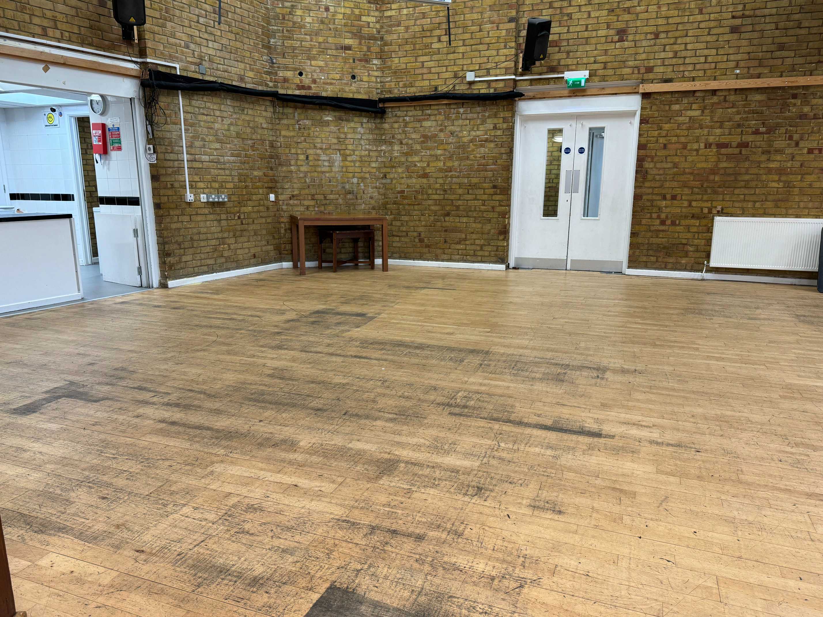 Spacious main hall at Draper Hall with 100-seat capacity, ideal for rehearsals, workshops, and celebrations.