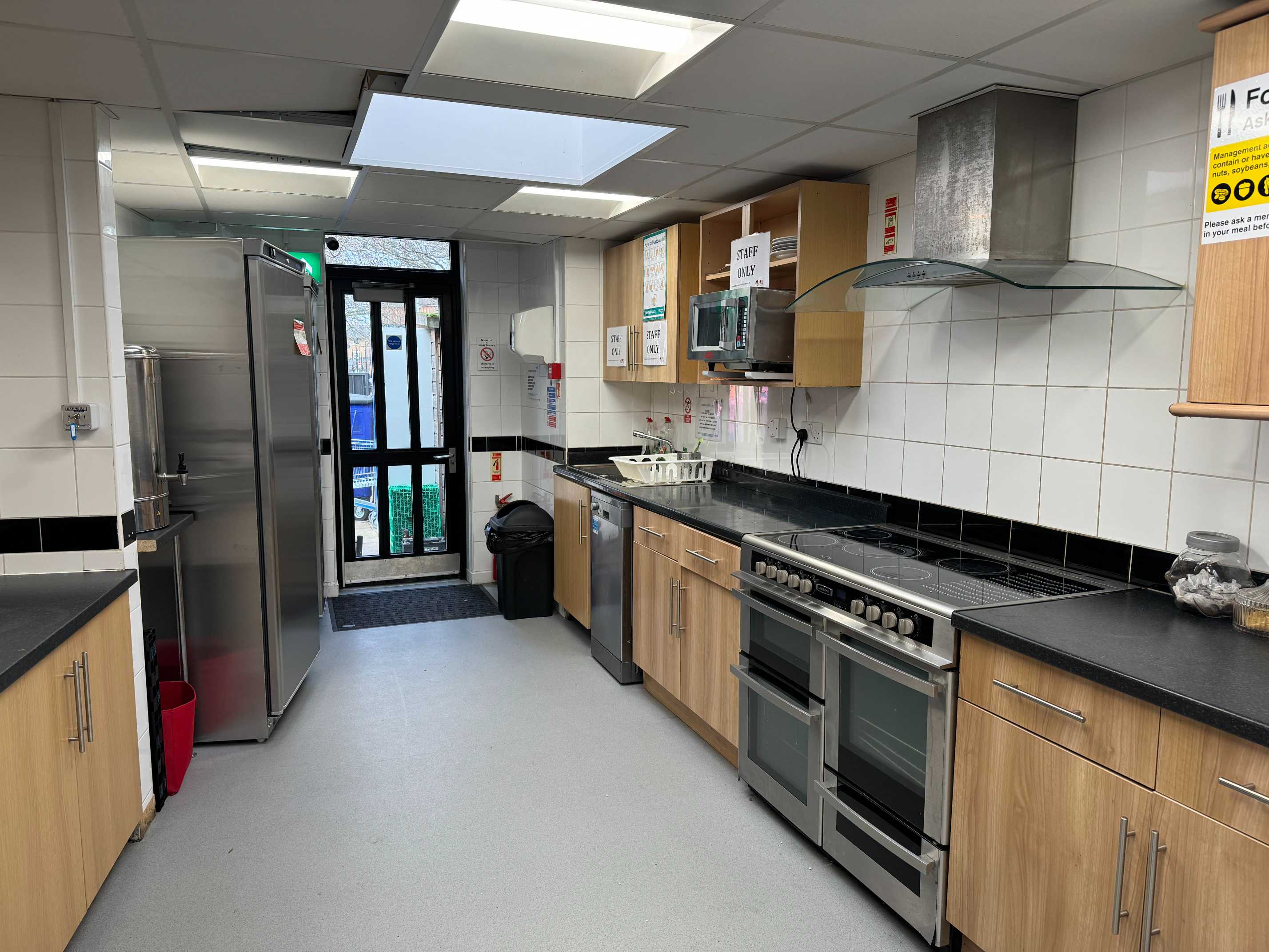 Draper Hall kitchen facilities with fridge, hob, and microwave — ready for self-catering or light refreshments.