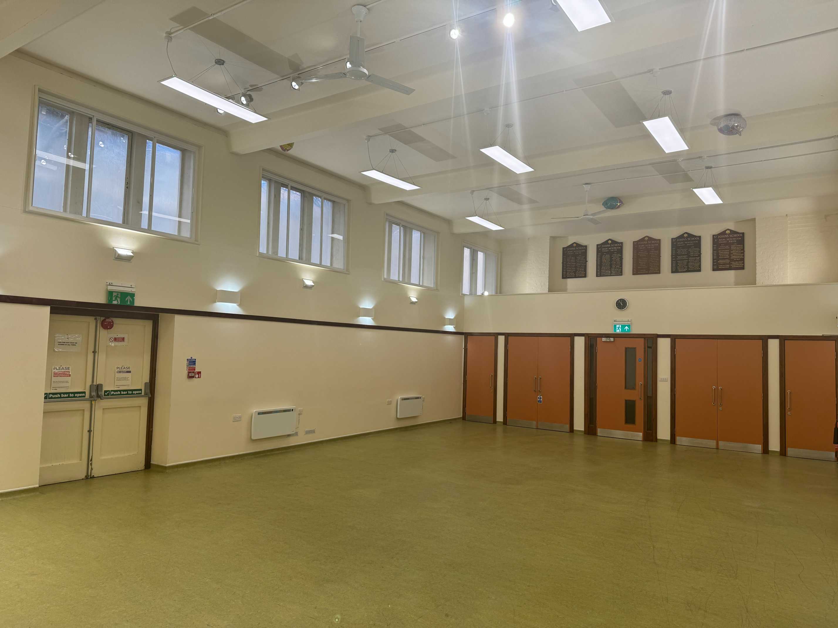 Wide-angle view of the main hall with seating for up to 80 people, perfect for parties or fitness classes