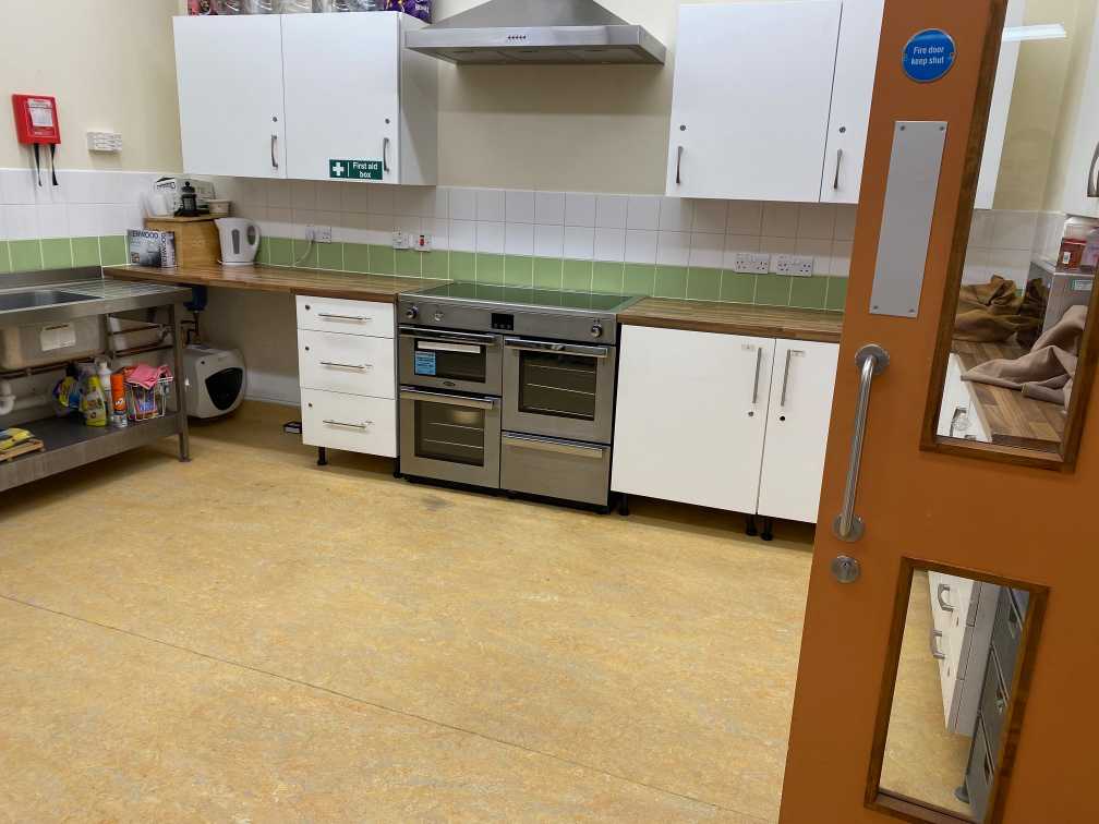Compact kitchen area with tea bar facilities, ideal for event catering and refreshments at St John's Centre