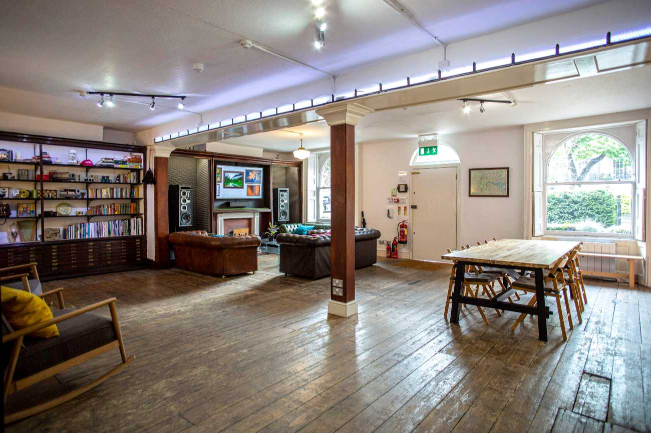 The Home at Anomalous Space, London, a unique venue for 80 with lounge, dining table, and exposed wood floors, book via Conveenie.