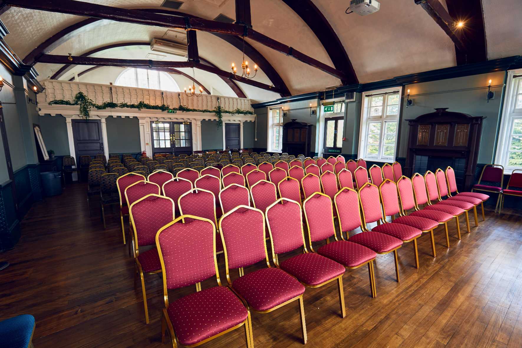 Seating arrangement with stylish tables and stacking chairs, perfect for elegant and flexible layouts.