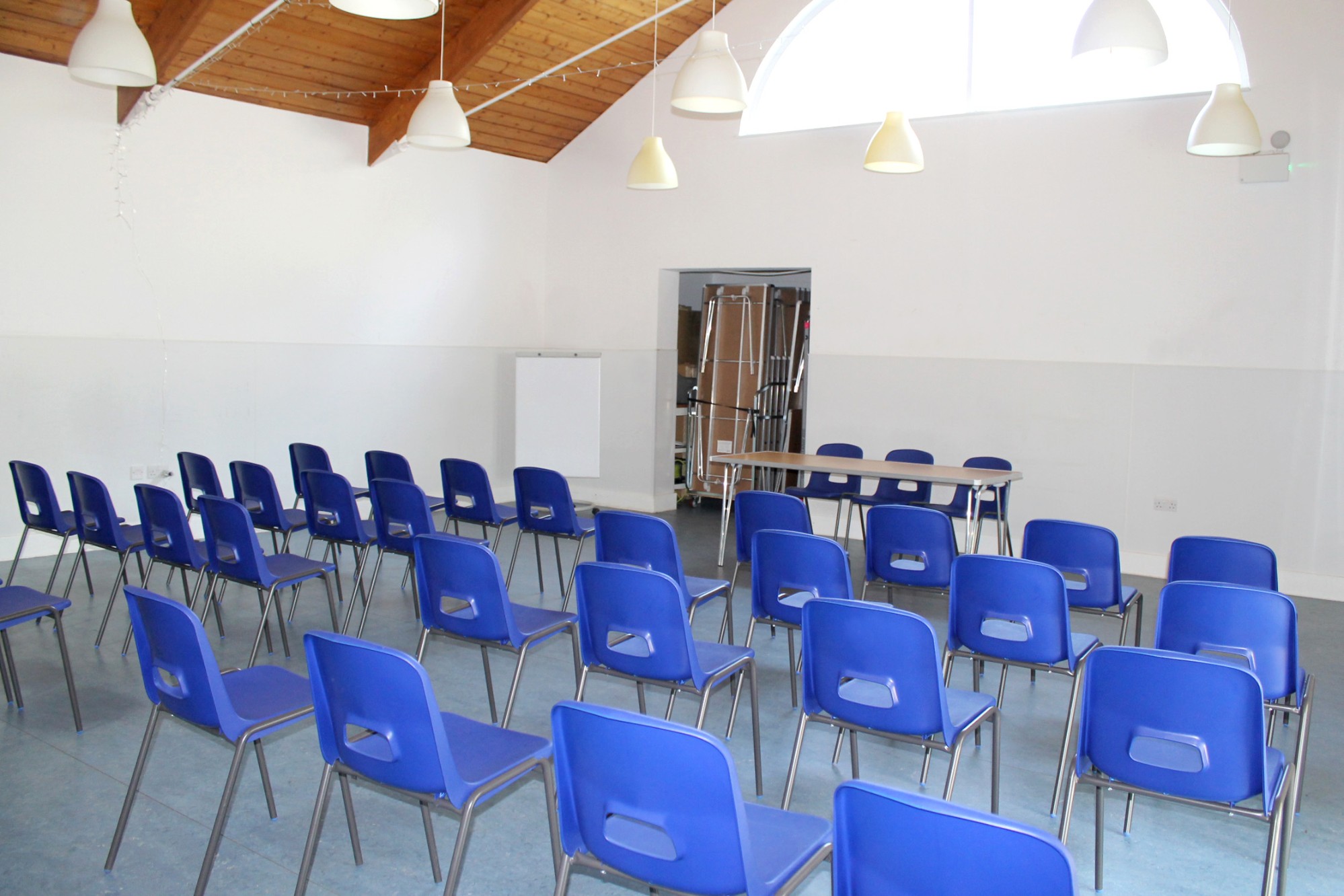 Well-lit interior of Castlehaven’s Devas Garden Room, perfect for workshops, talks, and family events.