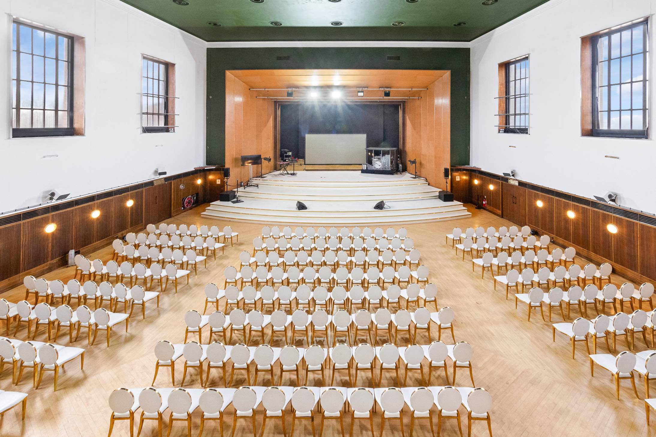 Borough Hall Auditorium vintage London wedding venue with high ceilings, stage, and retro architectural details.