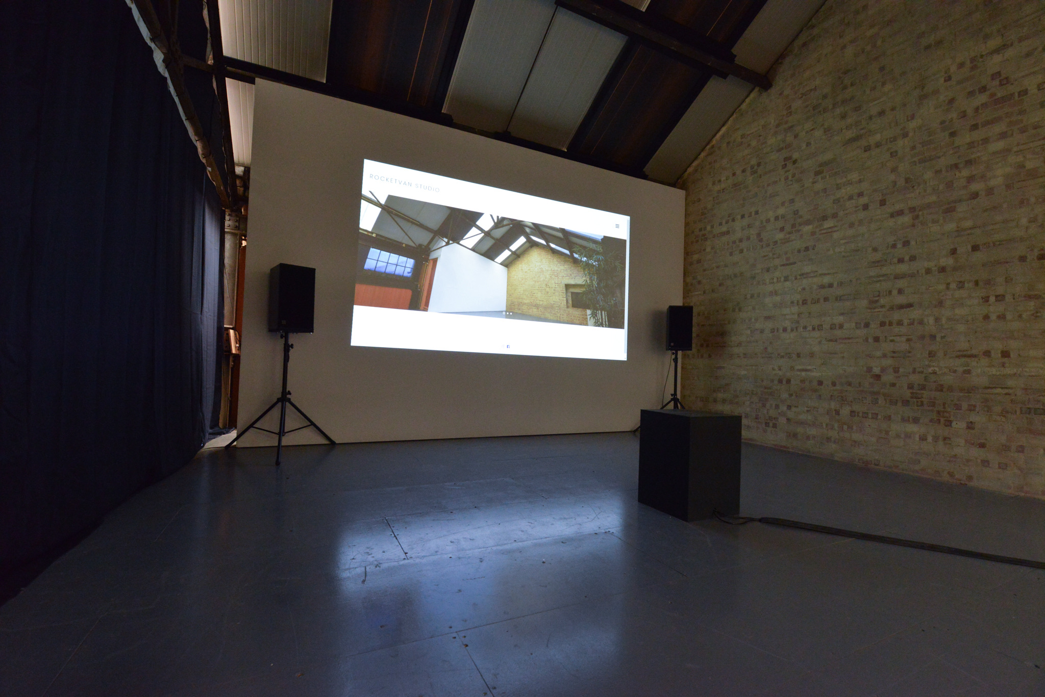 Seating layout with folding chairs and large tables, suitable for gatherings of up to 30 people in the studio