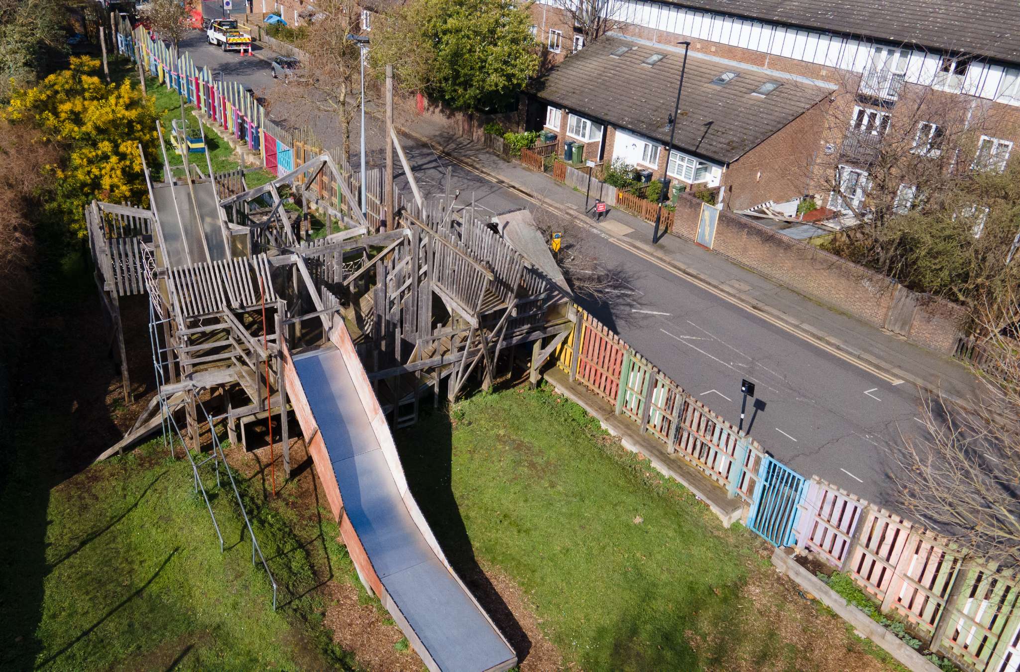 Fun outdoor play area at Dexters with slides and colourful court—perfect for up to 100 kids and families