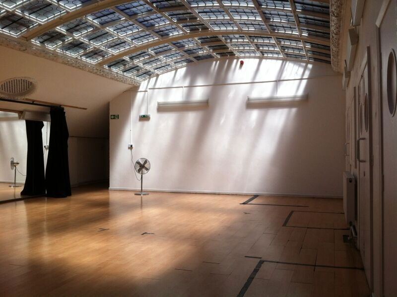 The Studio at Chats Palace Arts Centre, a 30-capacity space, features a polished wooden floor, white walls, and a stunning ornate glass ceiling.