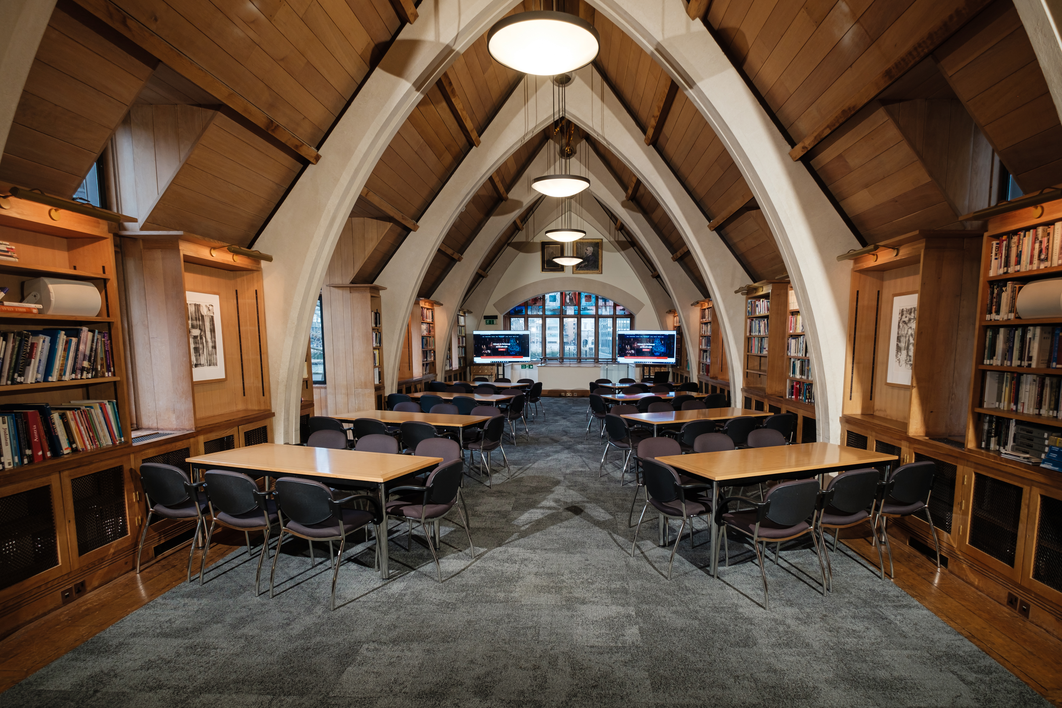 Ceiling view of Garry Weston Library with tall windows, soft lighting, and architectural details of Southwark Cathedral