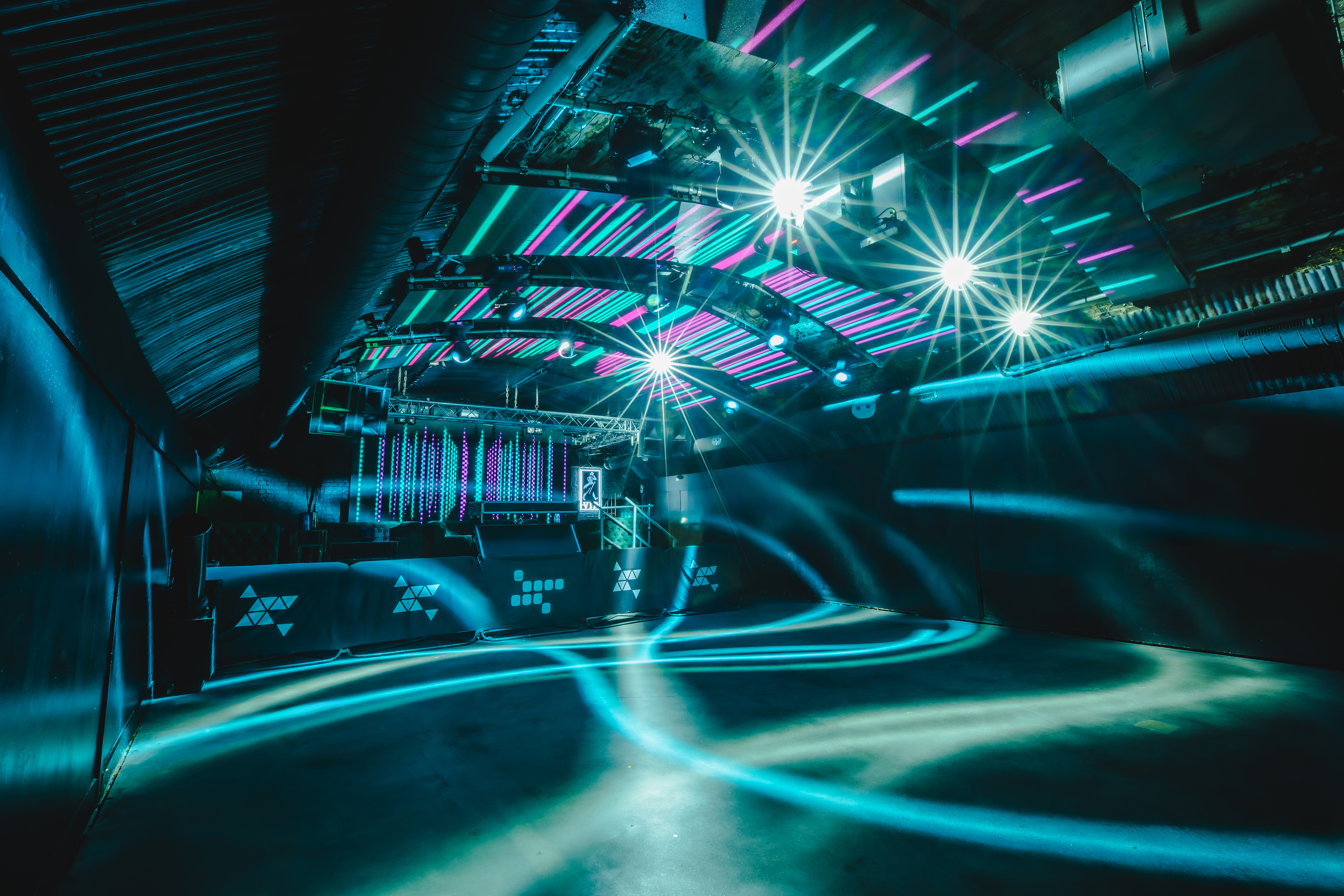 The 600-capacity Fire Main Room at Vauxhall Arches, listed on Conveenie, is set theatre-style with black chairs and advanced digital ceiling panels.