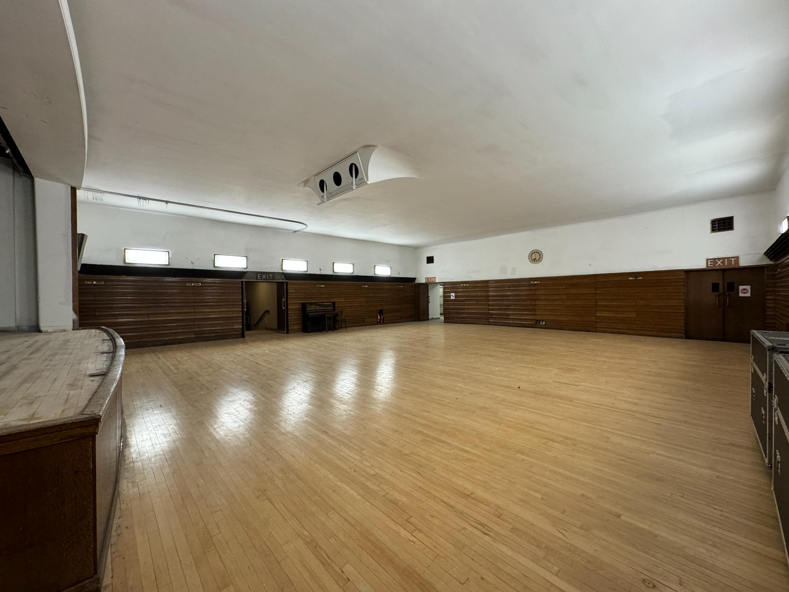 The reception area of The Borough Hall, with a large yellow "Welcome" sign for Greenwich Dance.