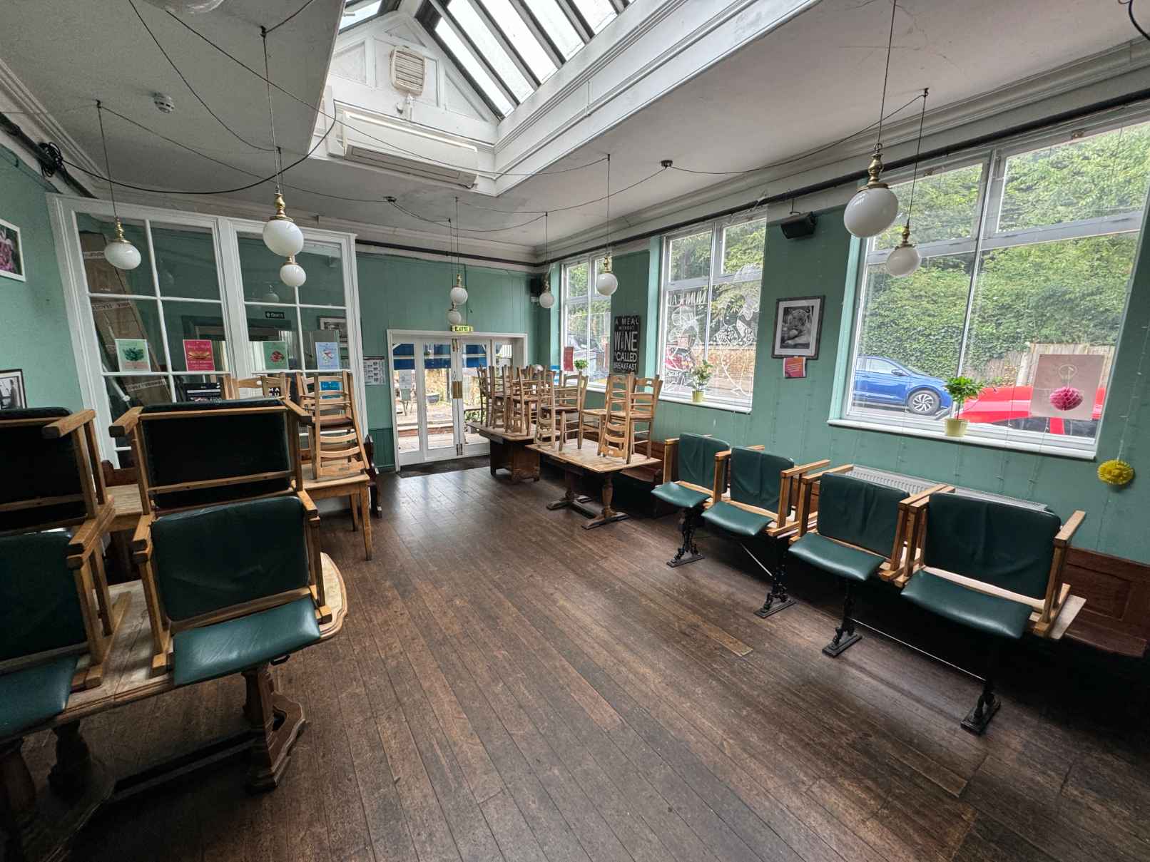Cosy pub interior with soft lighting and skylights in South Bermondsey, perfect for community and family events