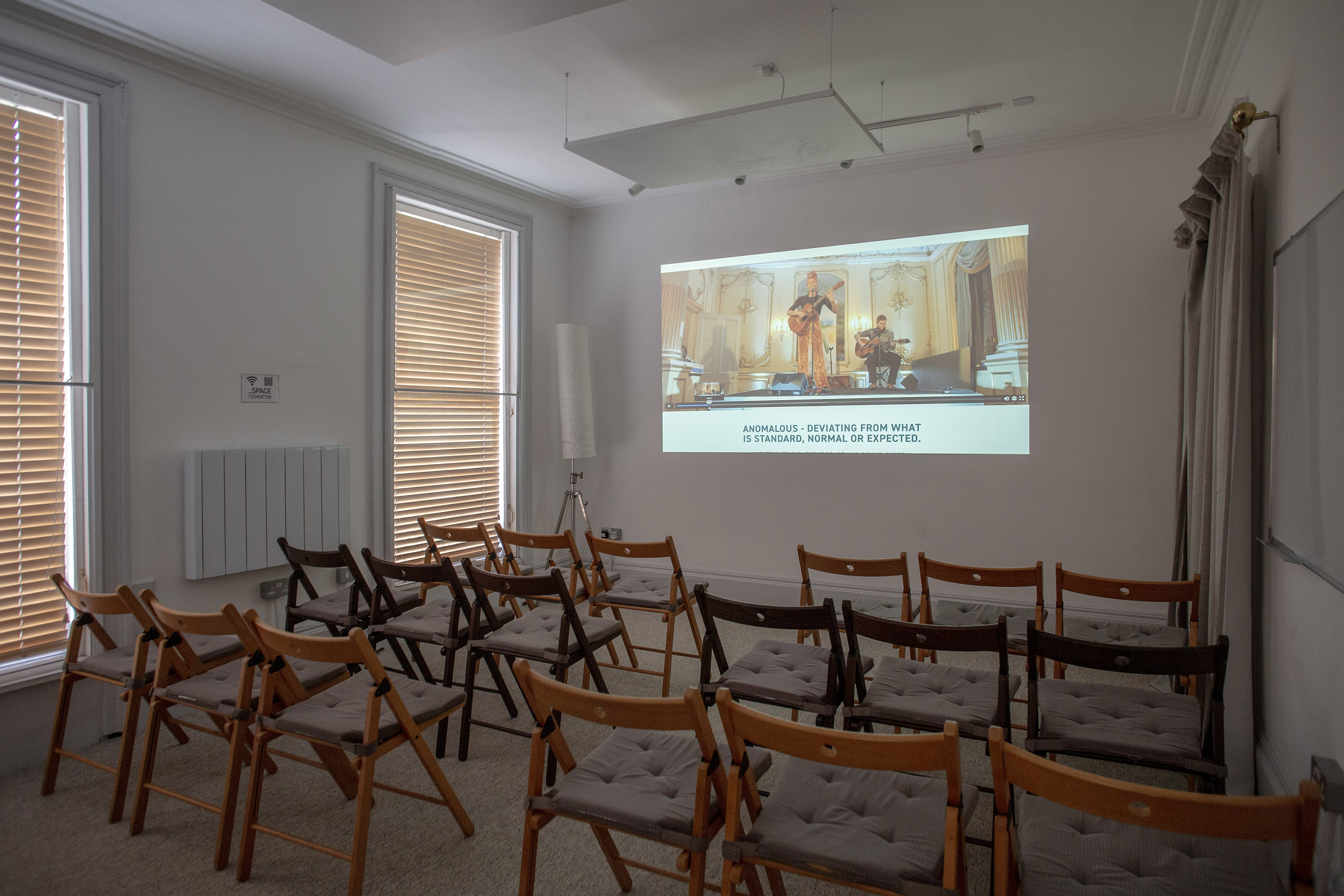 Versatile conference rooms in London at The Flat, Anomalous Space, set up theater-style for presentations, perfect for a meeting room hire.