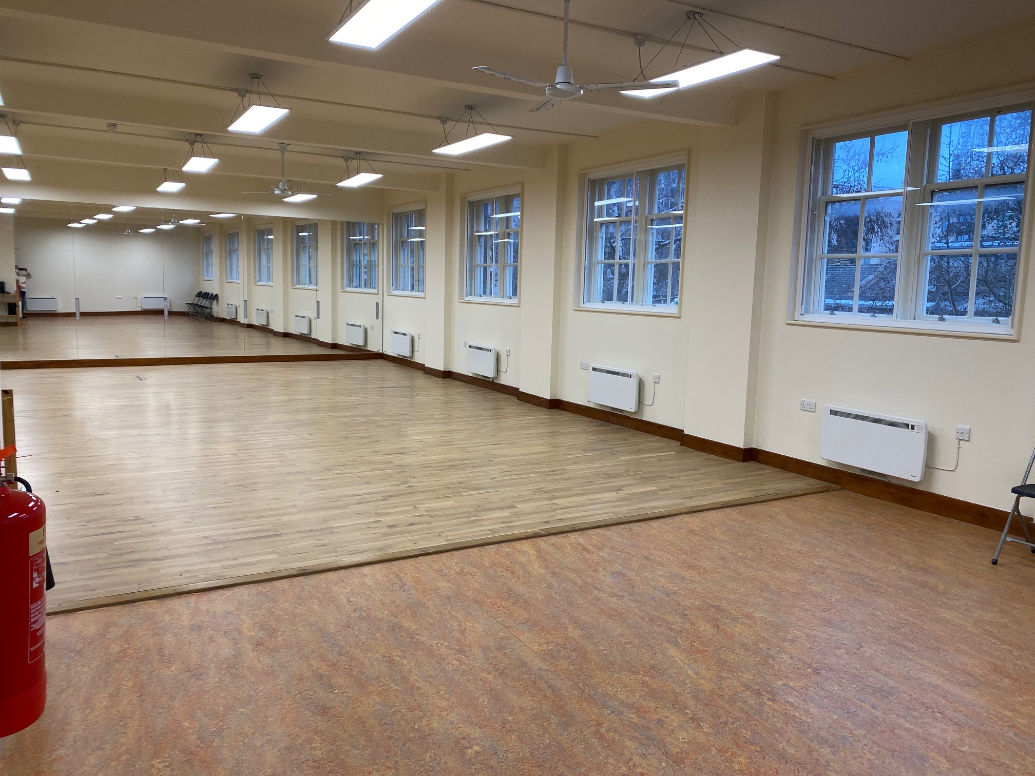 Natural skylights fill the dance studio with light, creating an uplifting and focused atmosphere for sessions
