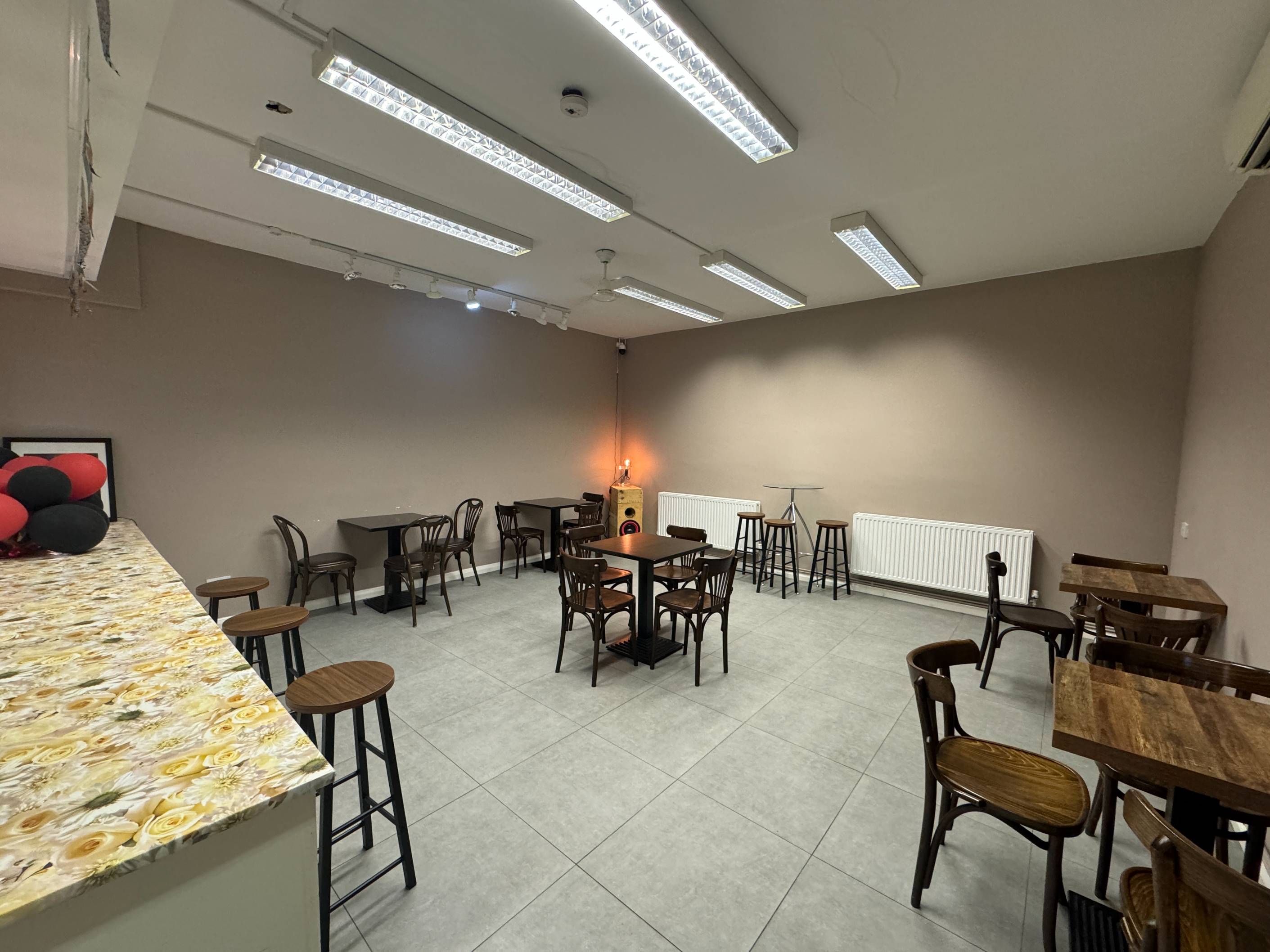 Upstairs at Brixtonia Lounge, showcasing open floor space and calm atmosphere for creative gatherings.