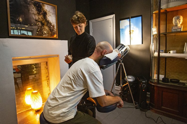 The Den at Anomalous Space, Pentonville Rd, London, for 3, featuring a man receiving a seated massage by a woman.