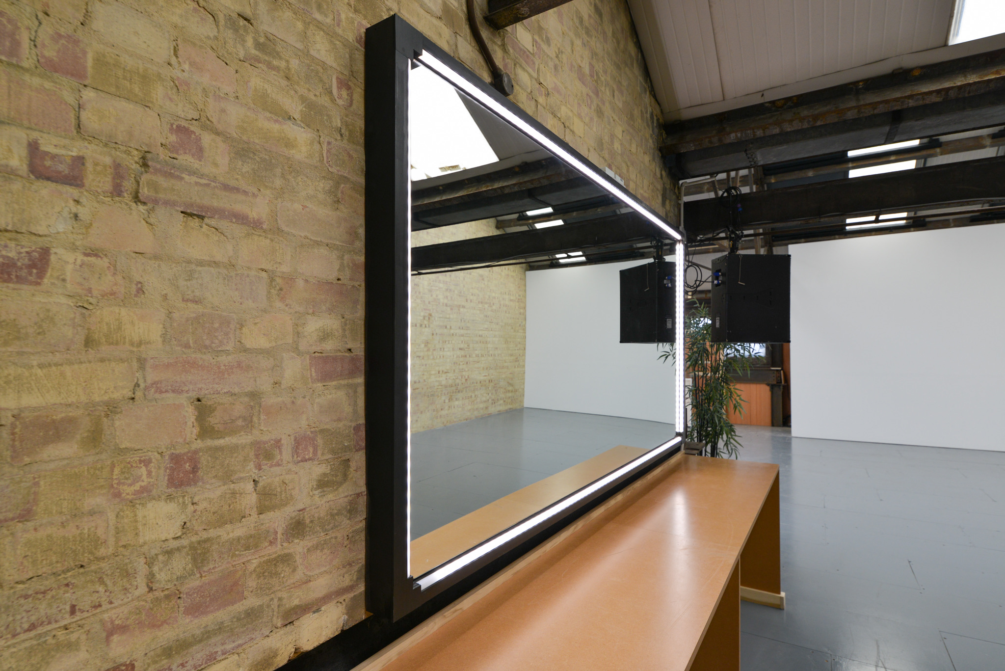 Mirror view inside Rocketvan Studio, reflecting its industrial design and flexible open-plan layout